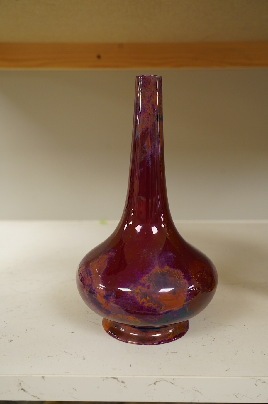 An early Royal Doulton flambé lustre bottle vase, early 20th century, 24cm high. Condition - good